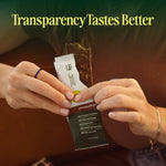 Person holding a protein bar package with 'Transparency Tastes Better' text above. - view 9