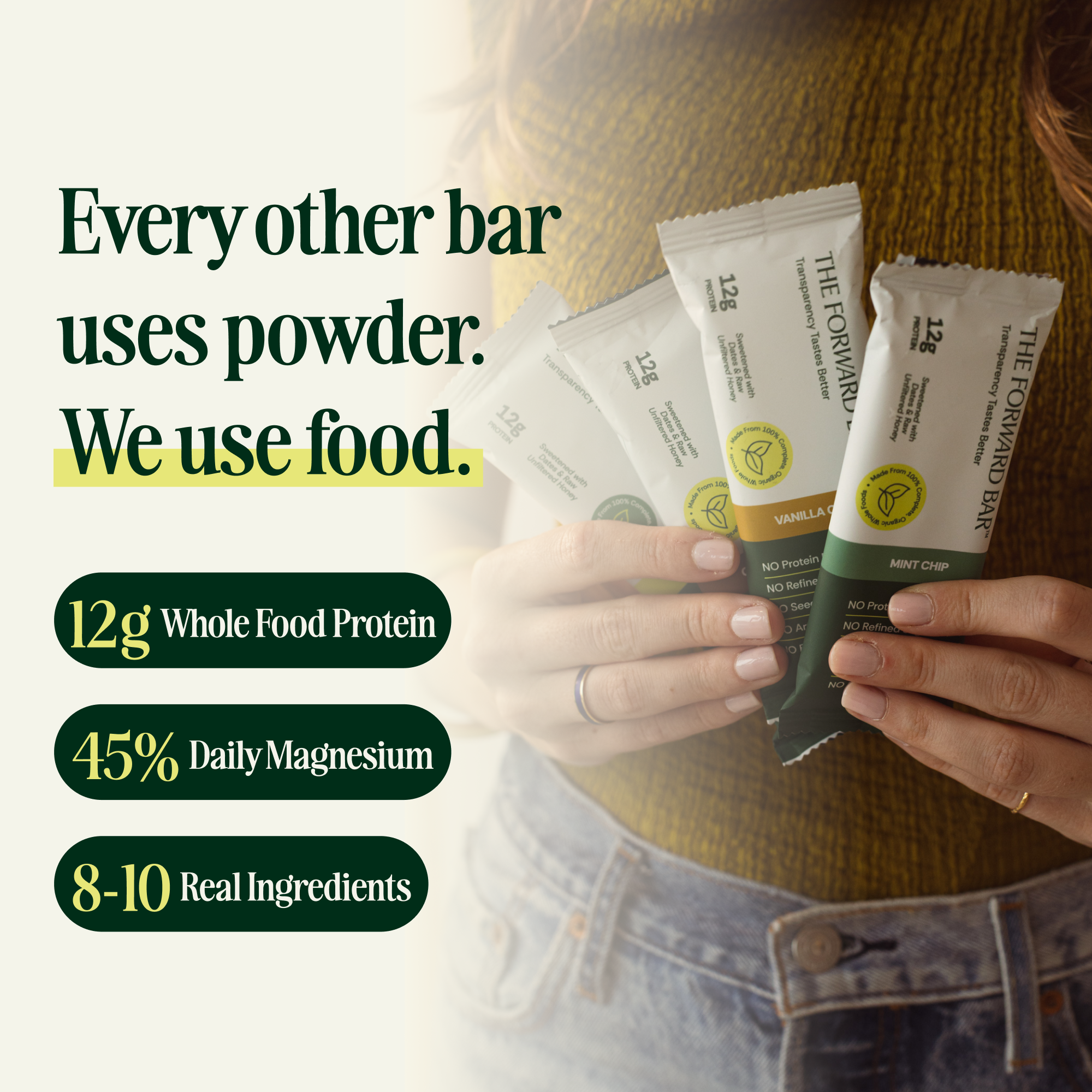 Person holding protein bars with text about ingredients and benefits