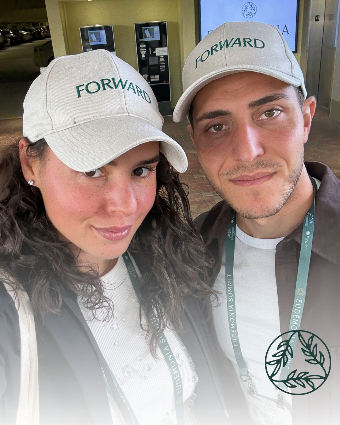 founders posing for a selfie at wellness summit in hats that say "The Forward Bar"
